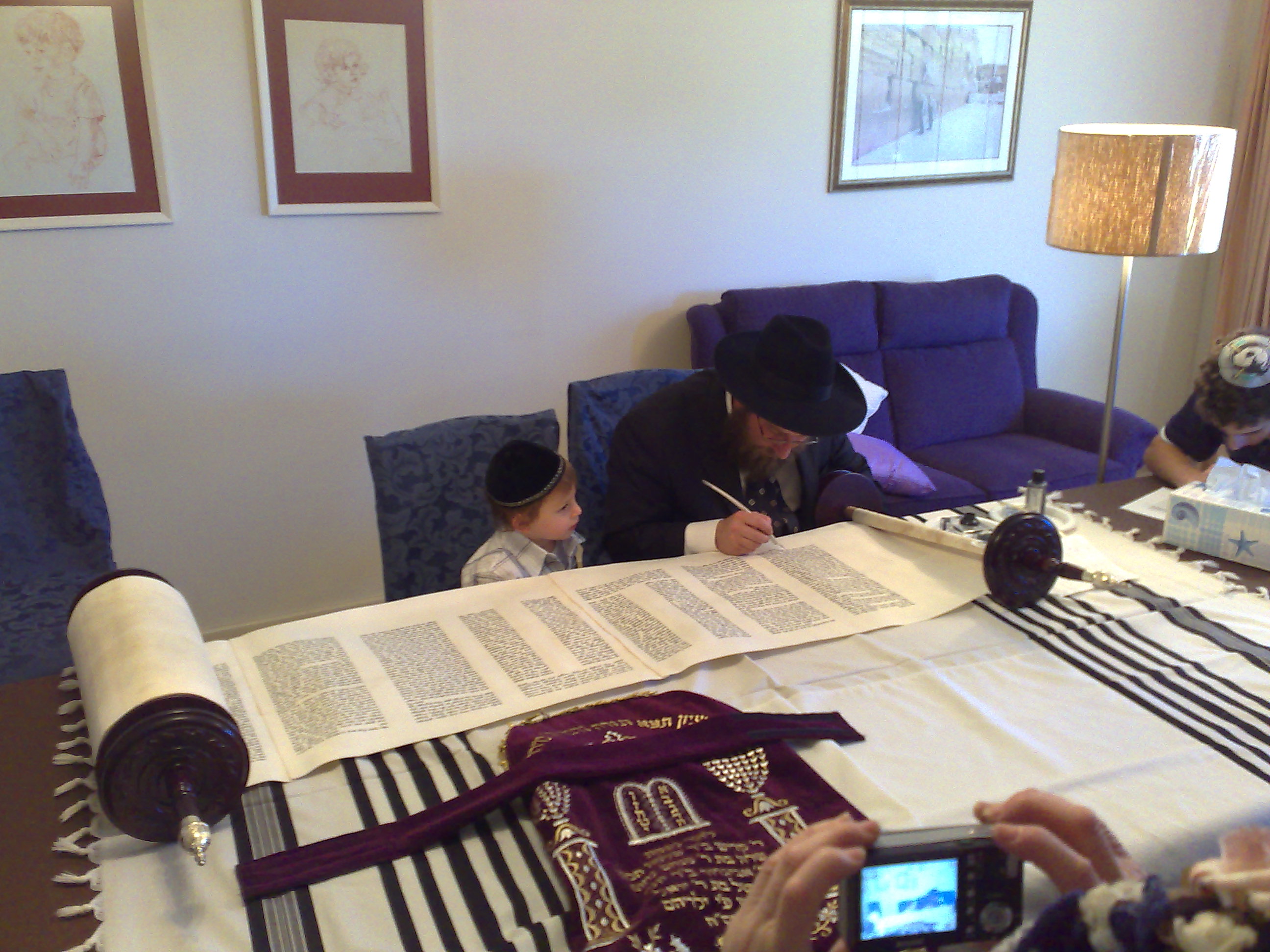 The Torah being completed
